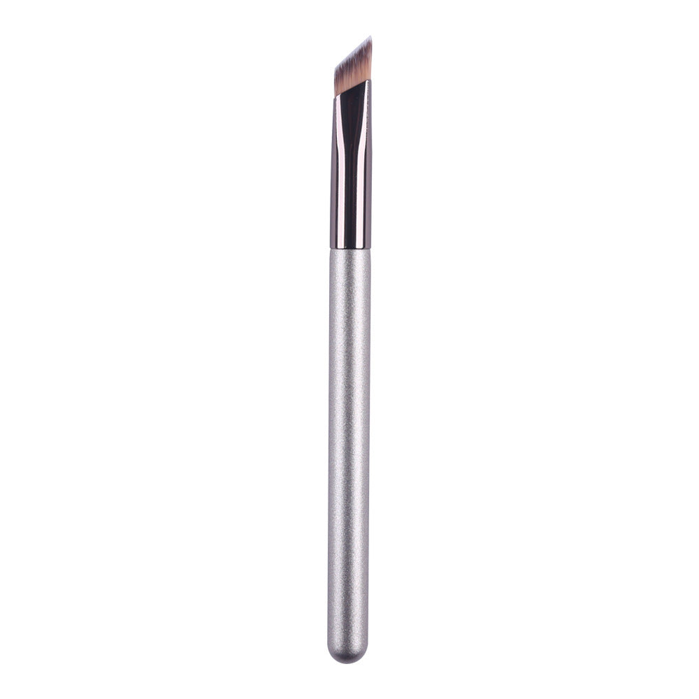 Makeup brush with a metallic handle on a white background