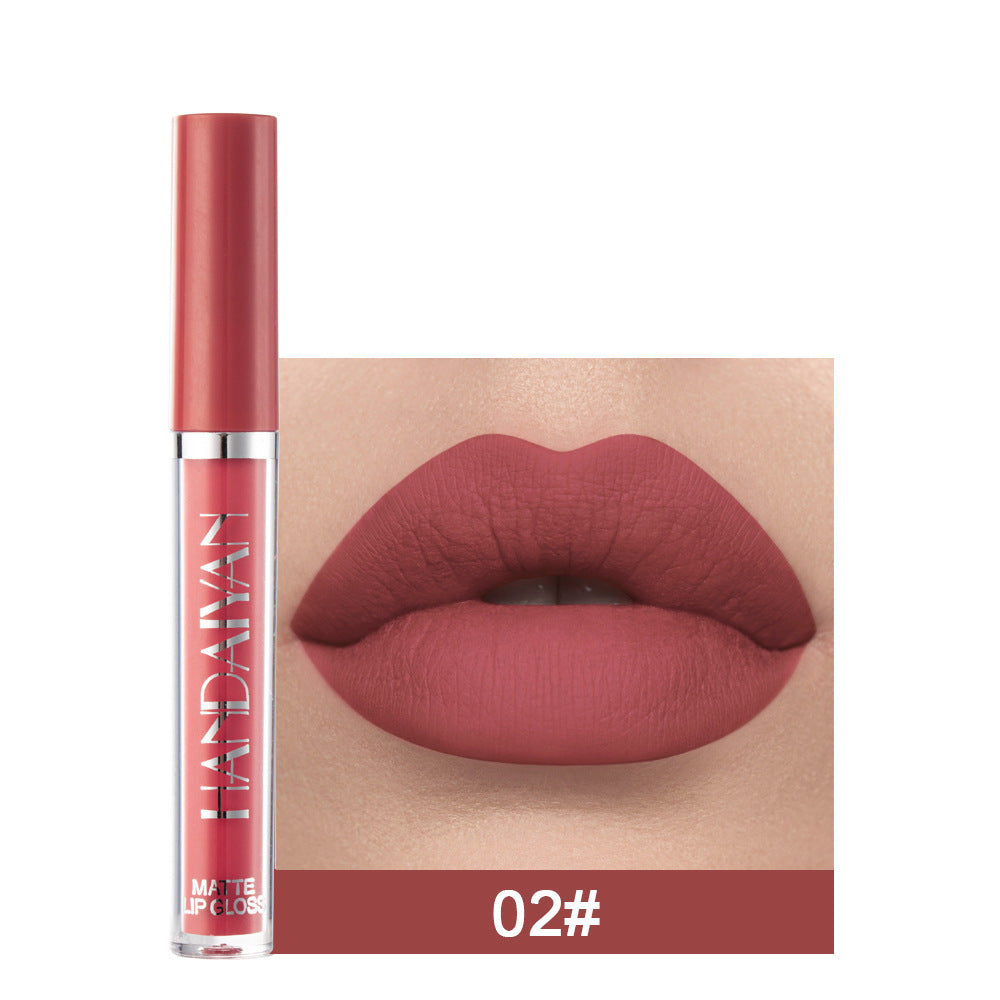 Lipstick with a close-up of lips wearing the color, brand 'Huda Beauty' visible.