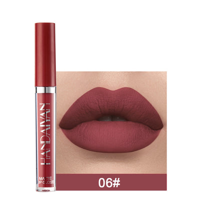 Lip gloss with a close-up of lips wearing the color, brand 'Huda Beauty' visible.