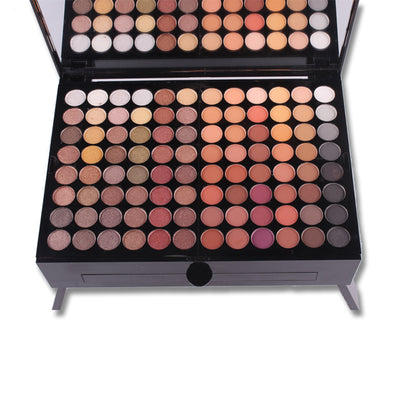 Makeup palette with various eyeshadow colors on a white background