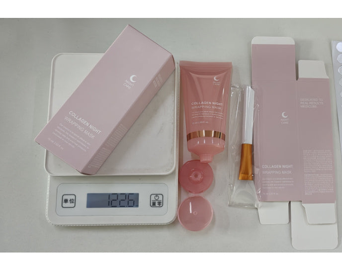 Cosmetic set with pink packaging on a digital scale