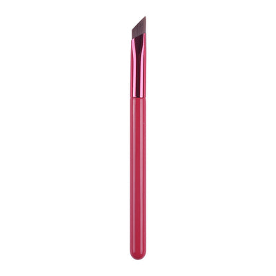 Red makeup brush with a pointed tip on a white background