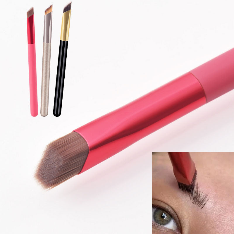 Makeup brush with pink handle and brown bristle, shown with close-up of use on eye.
