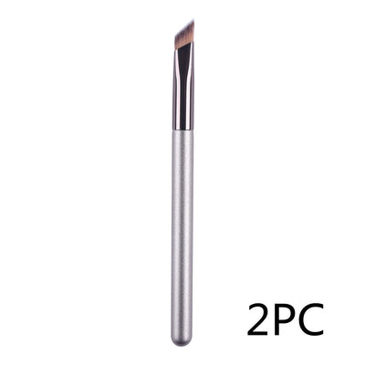 Makeup brush with silver handle and black bristle on a white background, labeled '2PC'.