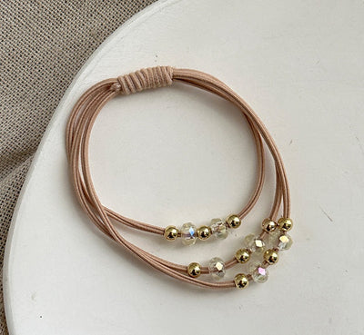 Light pink Durable Hair Rope Adult Hair Elastic Band with gold and clear beads, designed for fashionable and comfortable hair styling.